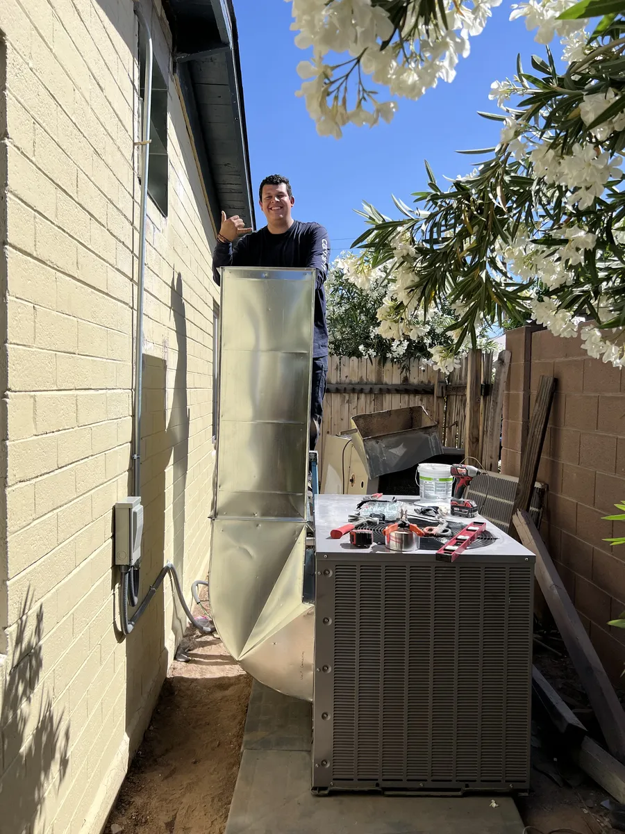 Ohana technician installing custom ductwork
